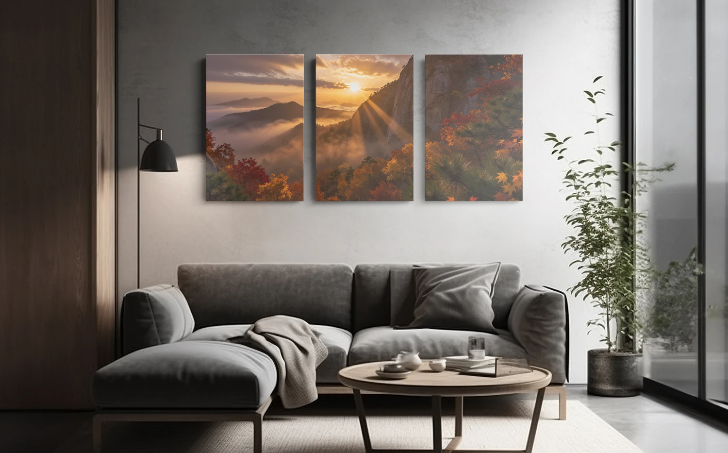 Sunrise mountain landscape triptych canvas wall art, front hanging above a sofa in a modern living room